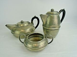 Vintage Hammered Pewter Tea And Coffee Pots With A Sugar Bowl