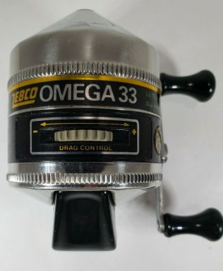 Zebco Omega 33 Push Button Casting Reel Metal Foot Made U.  S.  A.