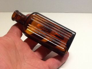 Small Antique Amber Ridge Poison Bottle.