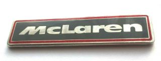 F1 Mclaren Badge.  Very Rare.  Size 60mm X 14mm.  Laminated Metal Badge.