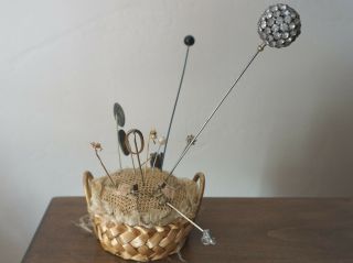 ANTIQUE BASKET STYLE PIN CUSHION WITH A VARIETY OF HAT PINS 2