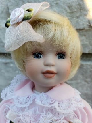 Porcelain 6 " Tall Vintage Doll With Blonde Hair And Blue Eyes On A Rocking Horse