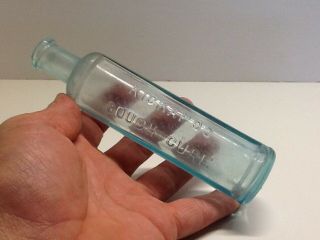 Antique Aqua Kickapoo Cough Cure Bottle.