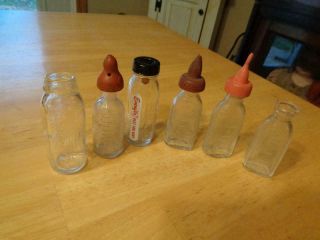 6 Vintage Glass Baby Doll Bottles 4 With Nipples 2 Evenflo/1 Petite Doll 2 W/dog
