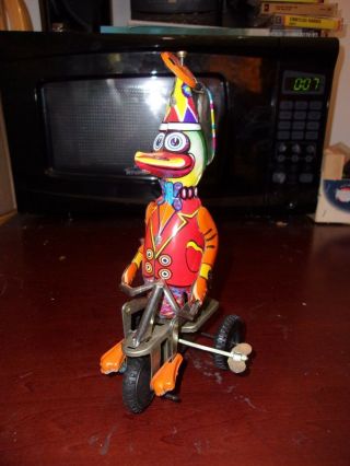 Vintage/antique Tin Litho Wind Up Toy Duck Riding Tricycle Bike,  W/ Key