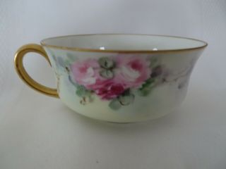 HAND PAINTED UNMARKED NIPPON TEA CUP AND SAUCER blue with pink roses 3