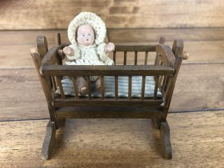 Vintage Wooden Dollhouse Cradle With Rubber Baby.