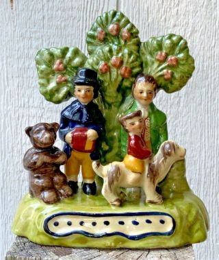Staffordshire Style Family Boy Riding A Dog With Bear In Front Of Tree