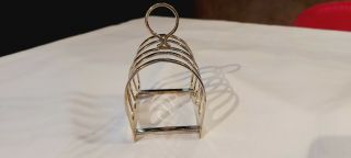 An Antique Silver Plated Toast Rack By Walker And Hall.  sheffield.  1930.  s. 3