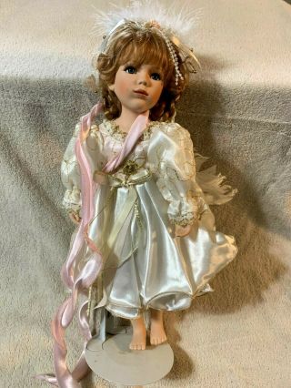 Vintage Geppeddo Porcelain Doll 15 Inch Doll With Braded Hair Dress And Wings.