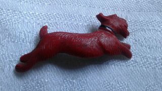 An Antique Vintage Cute Red Hard Plastic Textured Running Scottie Dog Brooch