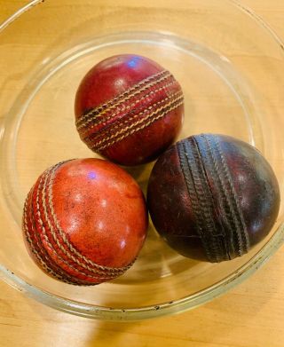 Three Antique Leather Cricket Balls