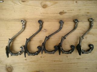 Set Of 5 Rococo Style Cast Iron Coat Hooks With A Brass Finish.