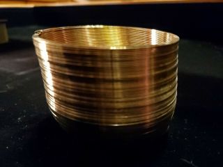 RARE - SLINKY 50th ANNIVERSARY 1945 - 95 Gold plated with wooden box. 3