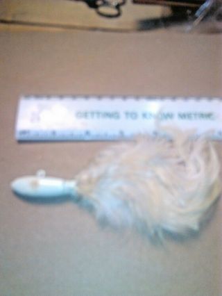 OLD LURE WE HAVE A WEIGHTED WHITE JIG WITH FEATHERS FOR LAKE TROUT FISHING/OLD. 2