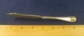 Simeon L & George H Rogers Co.  A1 Silverplate Twisted Handle Butter Knife Beaded