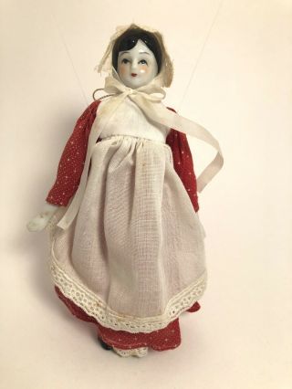 Vintage 7 3/4” Porcelain And Cloth Doll With Red Dress & Apron - Ornament