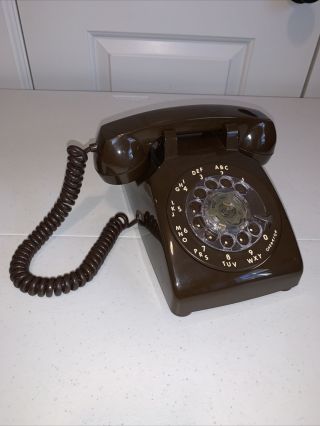 Classic Old Rotary Desk Phone In Brown