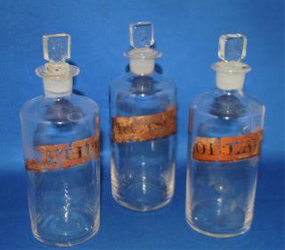 Three 7 " Antique Clear Glass Apothecary Bottles,  Gold Coloured Labels,  Victorian