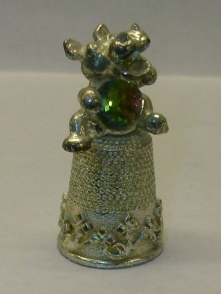 A Pewter Thimble Set With A Large Crystel Of A Caricature Of A - - Hippopotamus - -