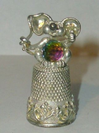 A Pewter Thimble Set With A Large Crystel Of A Caricature Of A - - Mouse - -