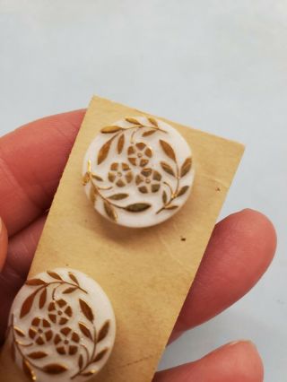 3 VINTAGE WHITE GLASS BUTTONS WITH RAISED GOLD ACCENTS LEAF AND FLOWERS 3
