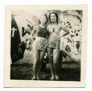Shapely Asian Swimsuit Girls In A Side Hug By Umbrellas,  Flags Old Photo