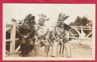 Three Indian Chiefs Sitting On The Porch With Their Headdress And Buckskin 