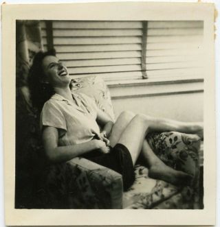 Pretty Woman Laughing Curled In Chair Legs Fun Interior Vintage Snapshot Photo