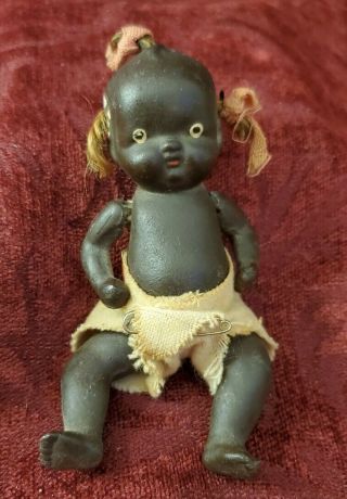 Vintage/antique Japan Miniature All Bisque Strung Dark Skin Baby Doll 4 1/2 In.