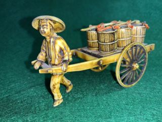 Vintage 4 1/2” Plastic Chinese Man From Barrels On A Rickshaw Wagon