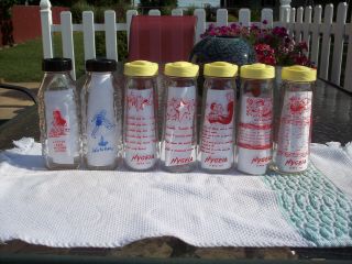 Vintage 5 Hygeia Nursery Rhyme Baby Bottles And 2 Unmarked Baby Bottles.