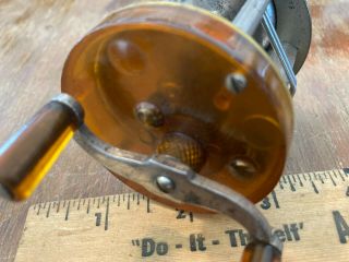Level Winding Baitcasting Reel With Clear Amber Face Plate