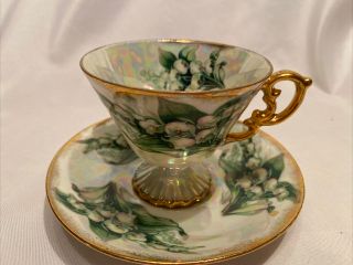 Vintage " Lily Of The Valley " Iridescent Footed Teacup And Saucer Gold Trim