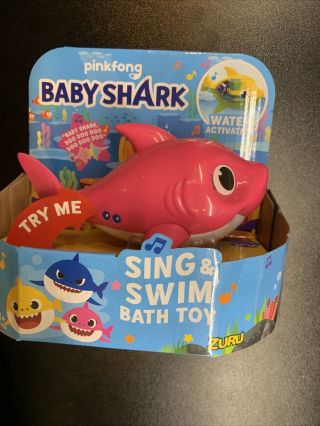 Robo Alive Junior Baby Shark Battery - Powered Sing And Swim Bath Toy Pink