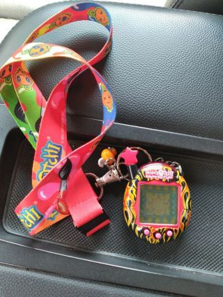 2004 Tamagotchi Connection V4.  5 FLAMES FIRE STAR RED,  YELLOW BLACK VERY RARE 2