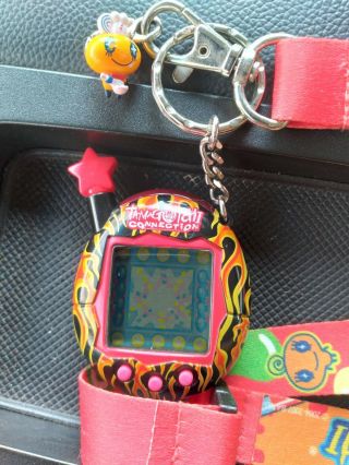 2004 Tamagotchi Connection V4.  5 FLAMES FIRE STAR RED,  YELLOW BLACK VERY RARE 3