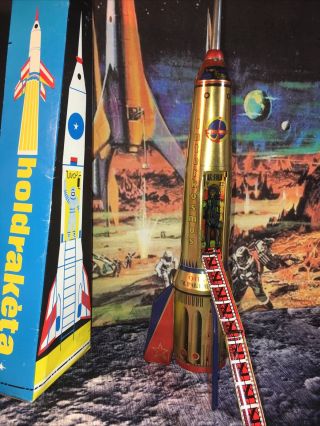 1960s Gold Tin Friction 15.  5” Tall Intercosmos Space Rocket Holdraketa
